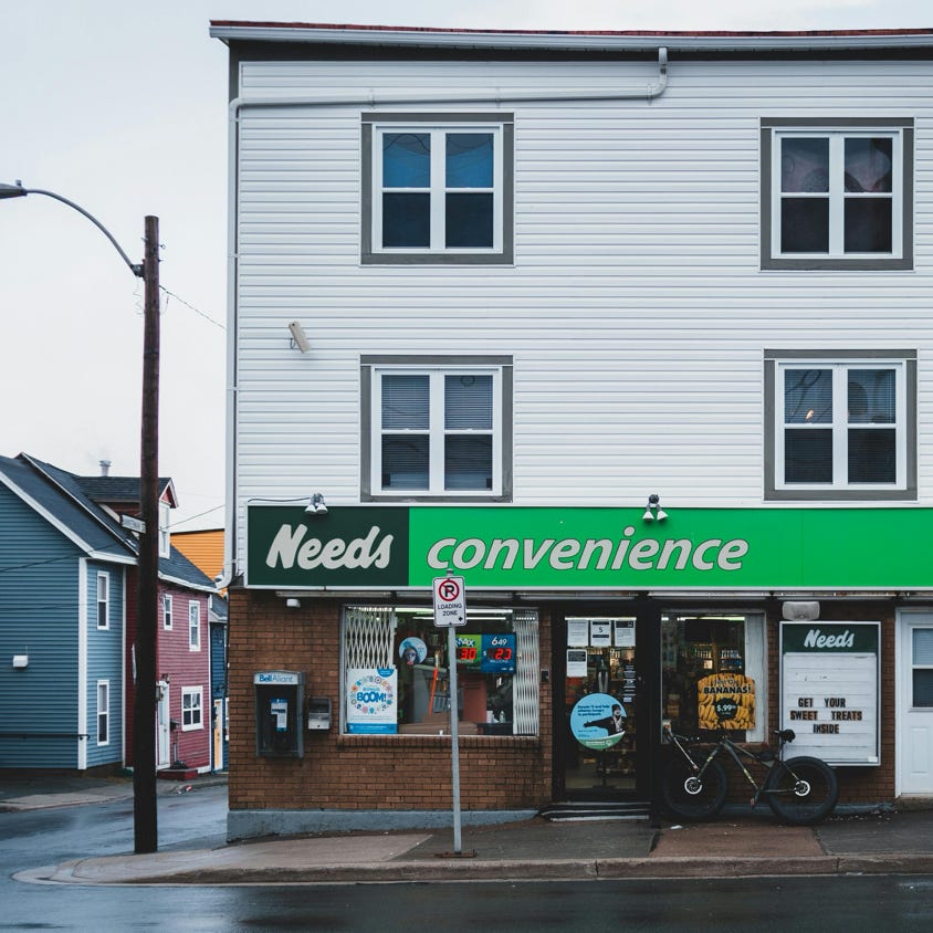 Front view of a convenience store located in a residential urban neighborhood.
